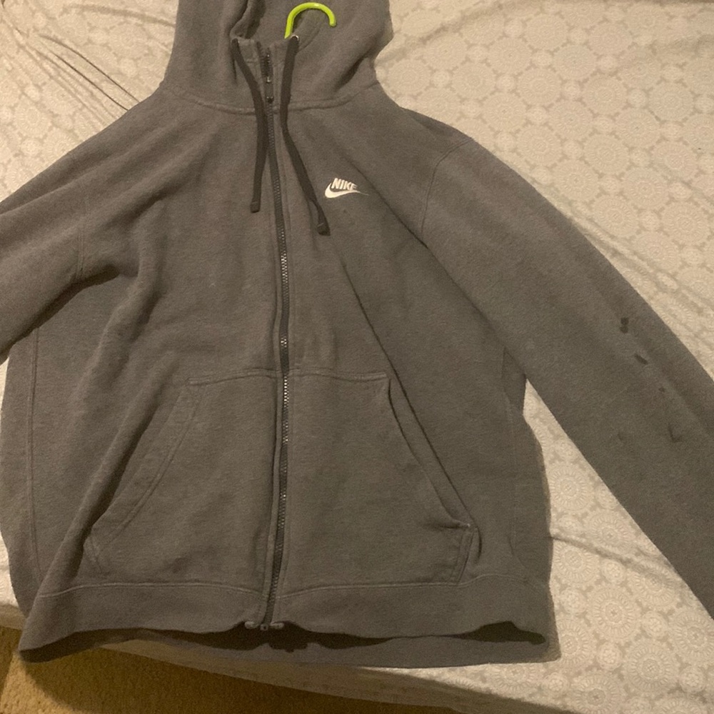 IT’sDark Grey Nike zip up, it’s comfortable to wear and when washed won’t fade